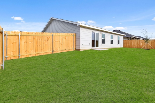 rear view of house with a lawn