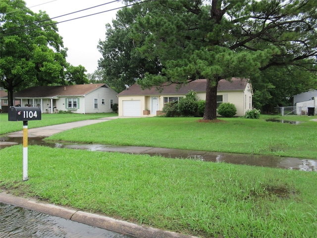 ranch-style home featuring a front yard