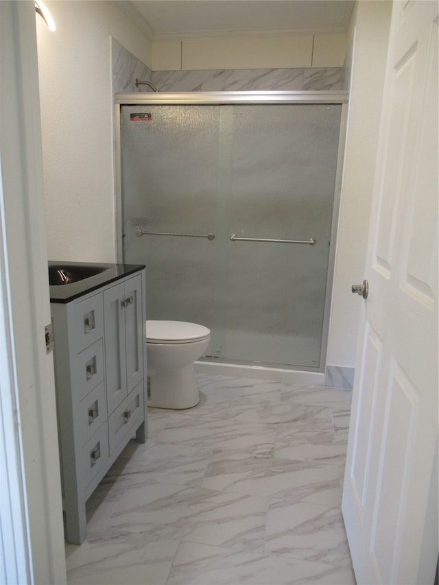 bathroom featuring vanity, toilet, and walk in shower