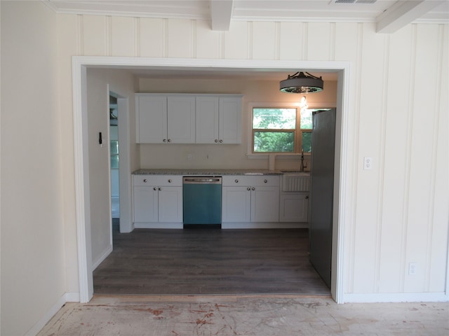 kitchen featuring beam ceiling, white cabinetry, sink, stainless steel appliances, and dark hardwood / wood-style floors