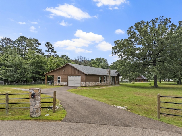 view of front facade featuring a garage and a front lawn