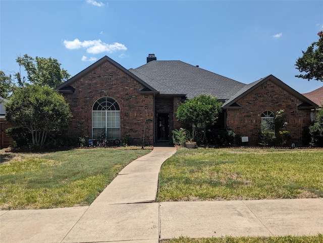 view of front facade with a front lawn