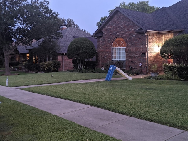 view of front of home with a front lawn