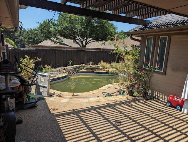 view of patio / terrace featuring a pergola and a fenced in pool