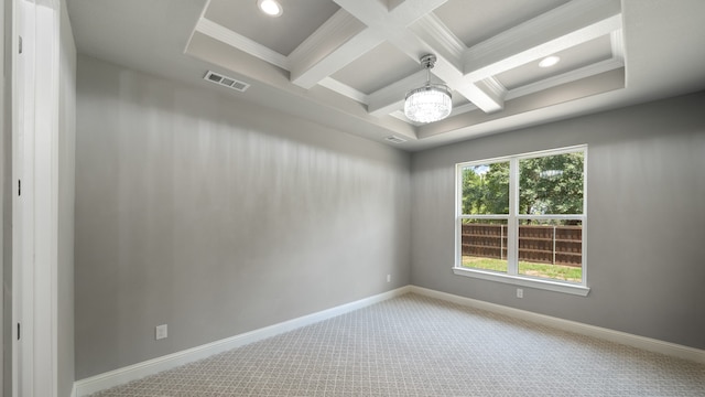 carpeted empty room with beamed ceiling, a notable chandelier, crown molding, and coffered ceiling