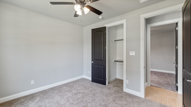 unfurnished bedroom with light carpet and ceiling fan