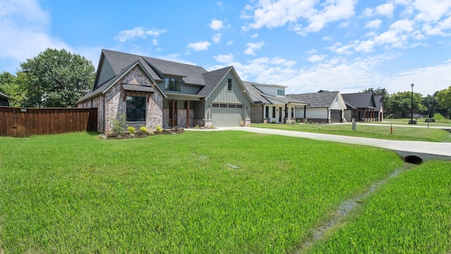 view of front of property featuring a garage and a front lawn