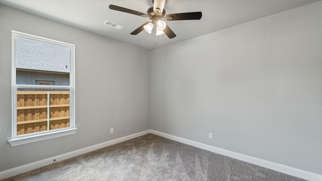 spare room featuring carpet, ceiling fan, and a healthy amount of sunlight