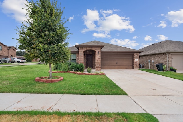 view of front of home with a garage and a front lawn