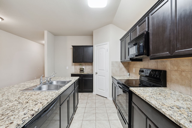 kitchen with light tile patterned flooring, dark brown cabinetry, sink, decorative backsplash, and black appliances