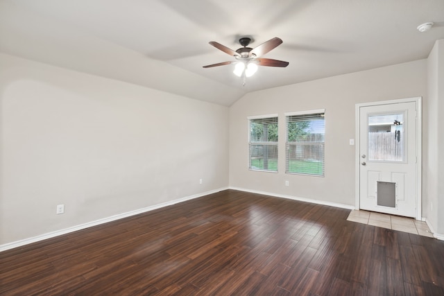 spare room featuring vaulted ceiling, ceiling fan, and hardwood / wood-style floors