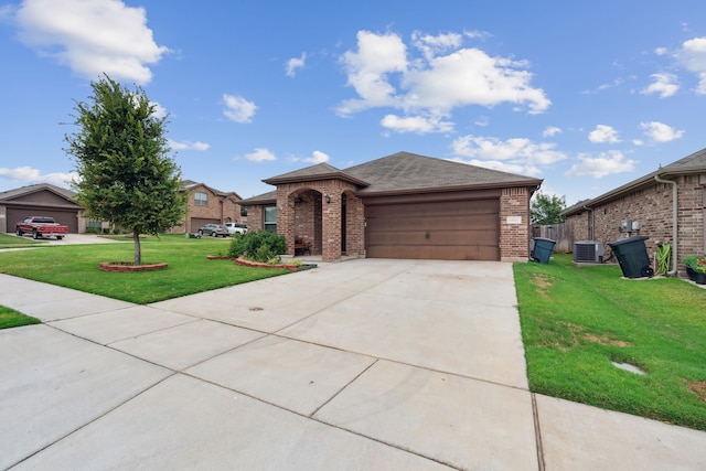 ranch-style home with central air condition unit, a garage, and a front lawn