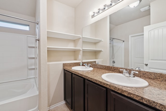 bathroom with shower / washtub combination and dual bowl vanity