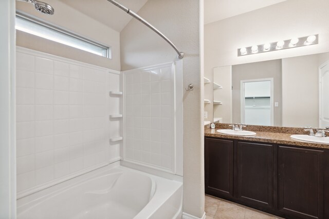 bathroom featuring tile patterned floors, bathtub / shower combination, and double vanity