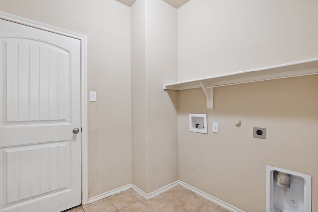 laundry room featuring light tile patterned flooring, hookup for an electric dryer, gas dryer hookup, and hookup for a washing machine