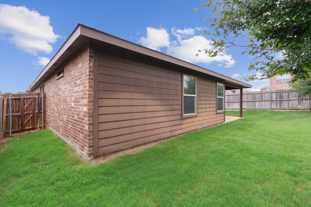 view of home's exterior featuring a lawn