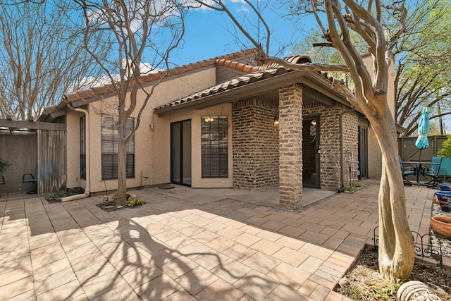 rear view of house featuring a patio area