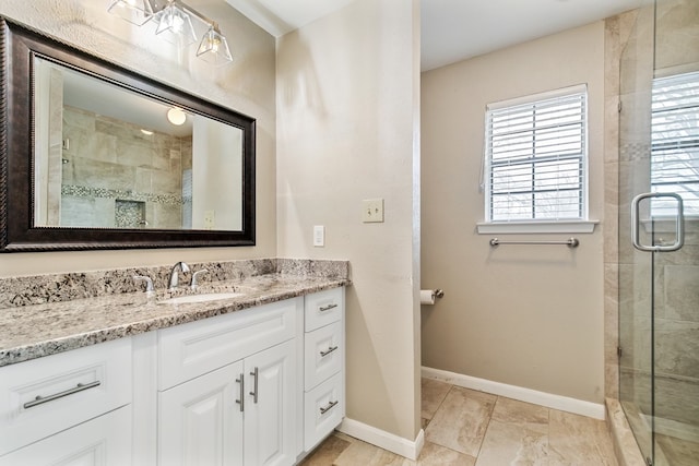 bathroom featuring vanity, tile patterned floors, and plenty of natural light