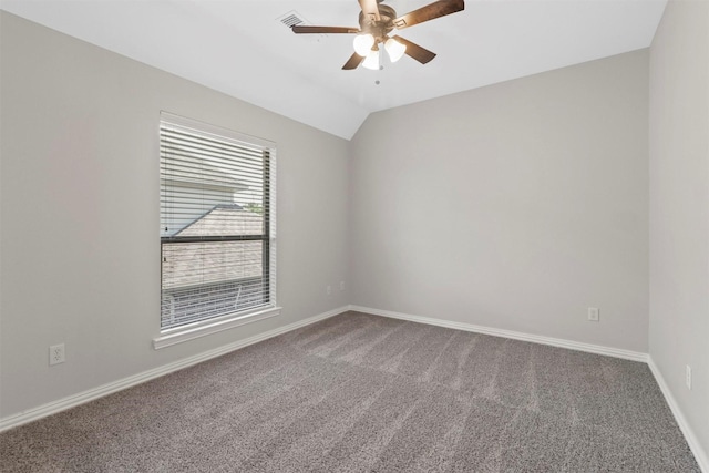 carpeted empty room featuring ceiling fan and lofted ceiling