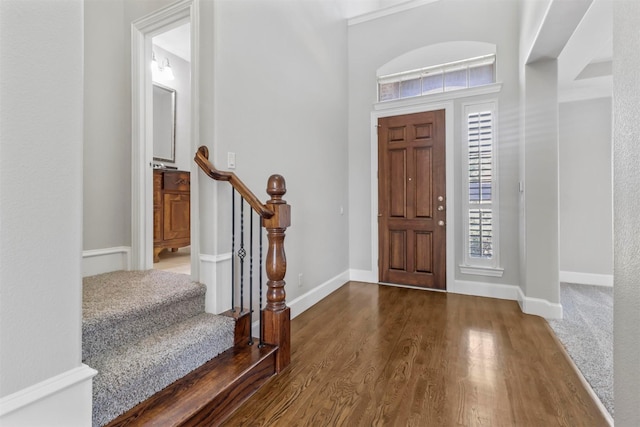 foyer entrance with a wealth of natural light and hardwood / wood-style floors