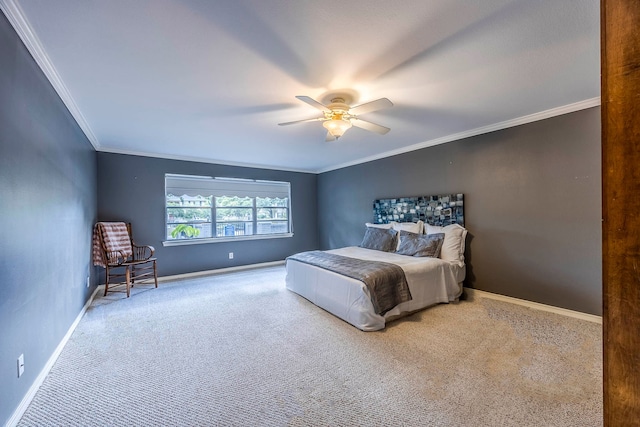 carpeted bedroom with ceiling fan and ornamental molding