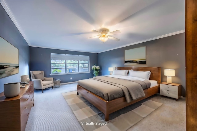 carpeted bedroom with ceiling fan and ornamental molding