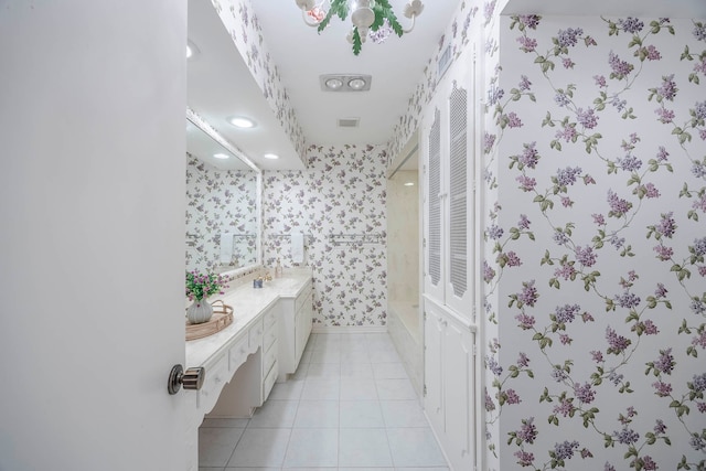 bathroom featuring tile patterned flooring and vanity