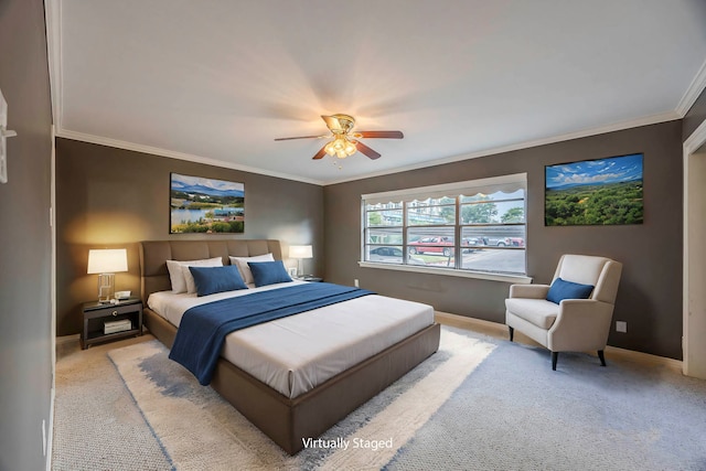 bedroom featuring ceiling fan, ornamental molding, and light carpet