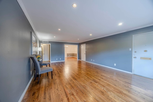 interior space featuring crown molding and hardwood / wood-style flooring