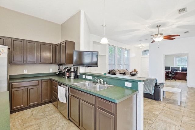 kitchen featuring sink, decorative light fixtures, light tile patterned floors, dishwasher, and ceiling fan