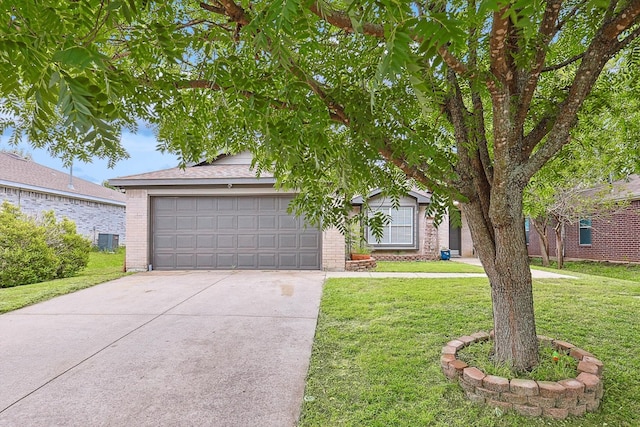 view of front of property with a garage and a front yard