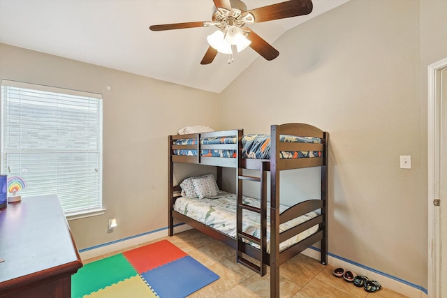 tiled bedroom with vaulted ceiling and ceiling fan