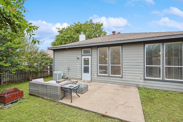 rear view of property with a patio, central air condition unit, a lawn, and an outdoor hangout area