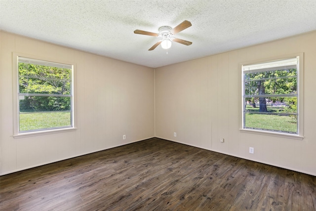 unfurnished room with dark wood-type flooring, a textured ceiling, and ceiling fan