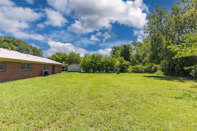 view of yard featuring central AC