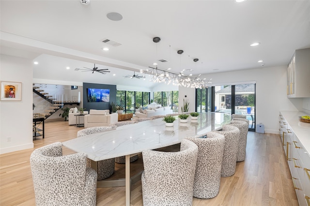 kitchen featuring pendant lighting, white cabinetry, and a healthy amount of sunlight