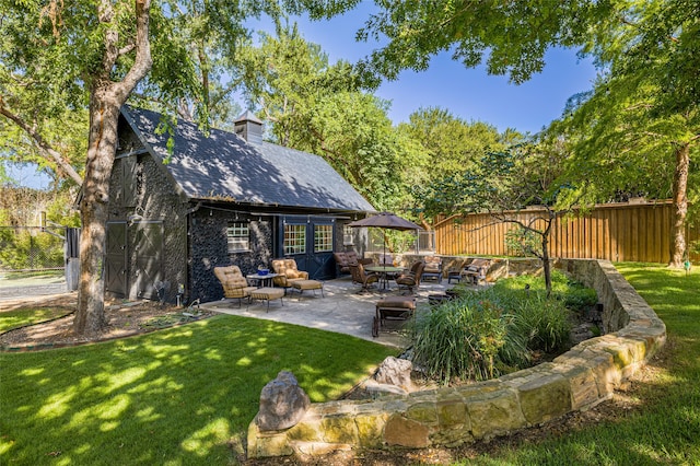 view of yard featuring a gazebo, an outdoor hangout area, and a patio