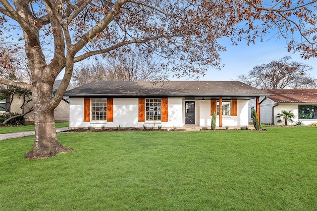 ranch-style home with a front lawn