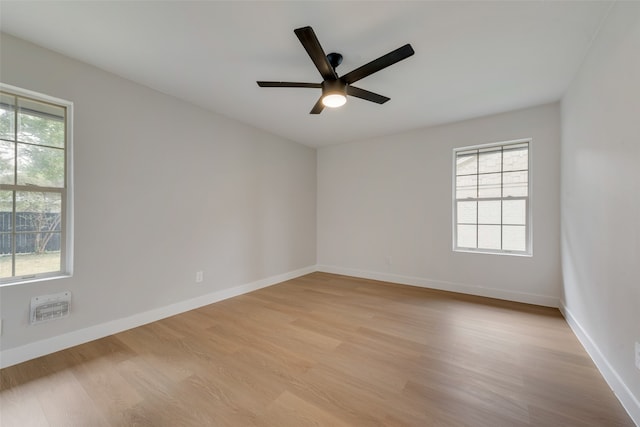 spare room with ceiling fan and light hardwood / wood-style flooring