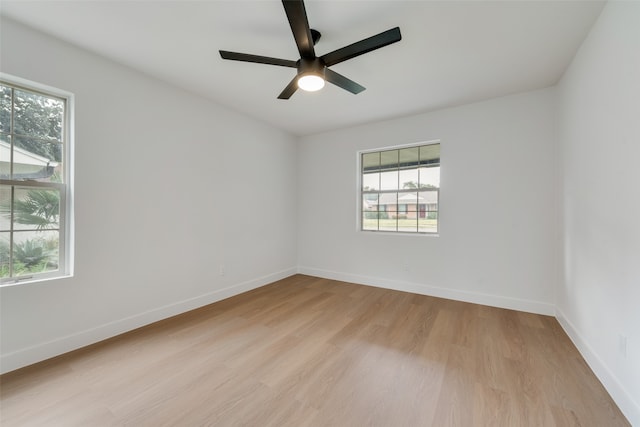 spare room featuring ceiling fan and light hardwood / wood-style floors