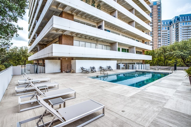 view of swimming pool featuring a patio area