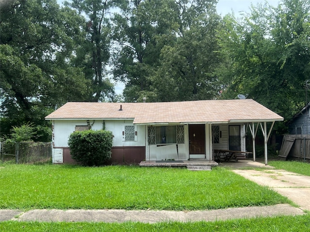 view of front of property with covered porch and a front lawn