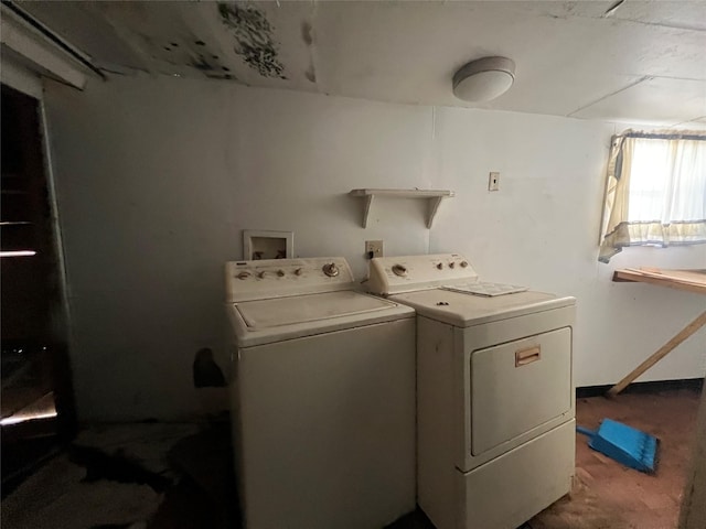 clothes washing area featuring washer and clothes dryer