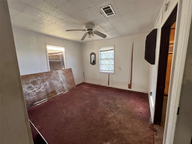 carpeted empty room with ceiling fan