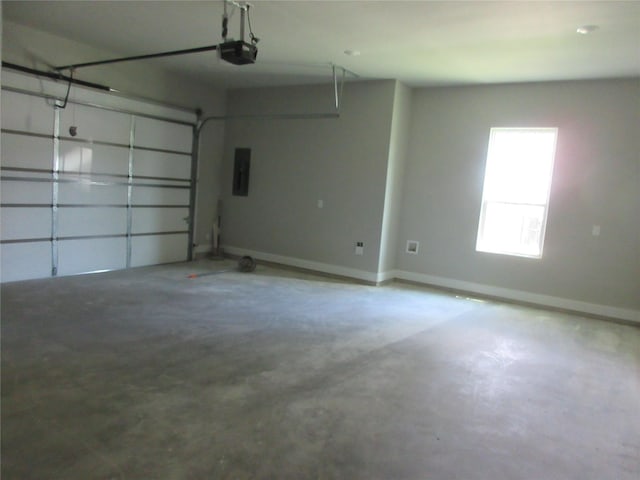 garage featuring a garage door opener and electric panel