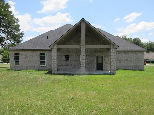 rear view of house with a lawn