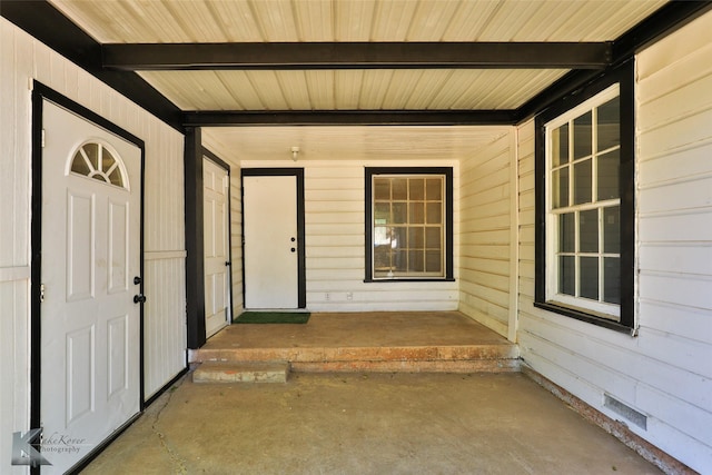 view of exterior entry featuring a porch