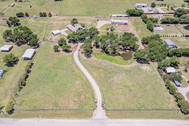 birds eye view of property with a rural view