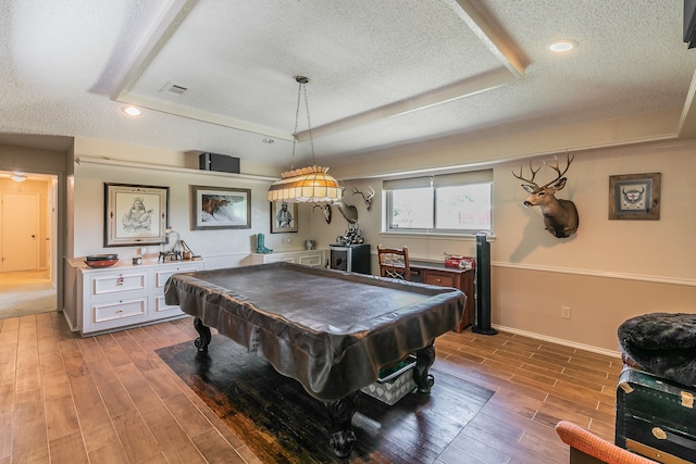 recreation room featuring a textured ceiling, a tray ceiling, and billiards