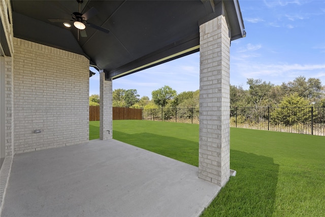 view of patio with a fenced backyard and ceiling fan